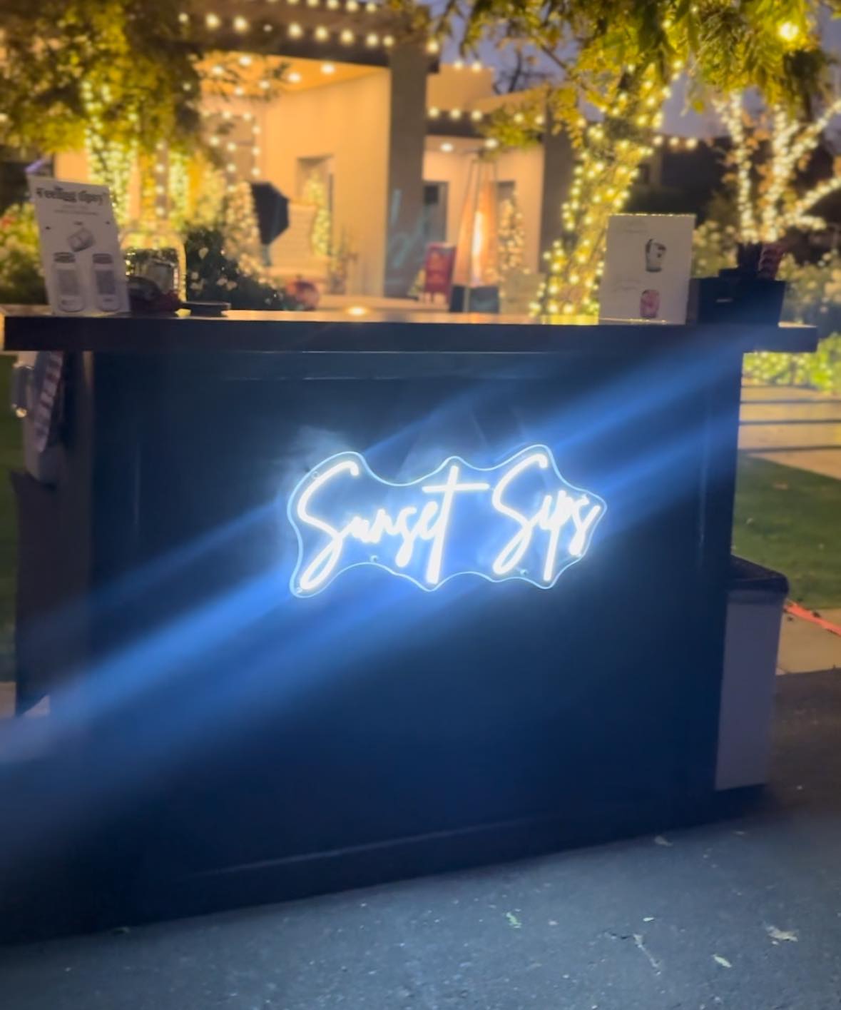Sunset Sips mobile bartending stand at an event