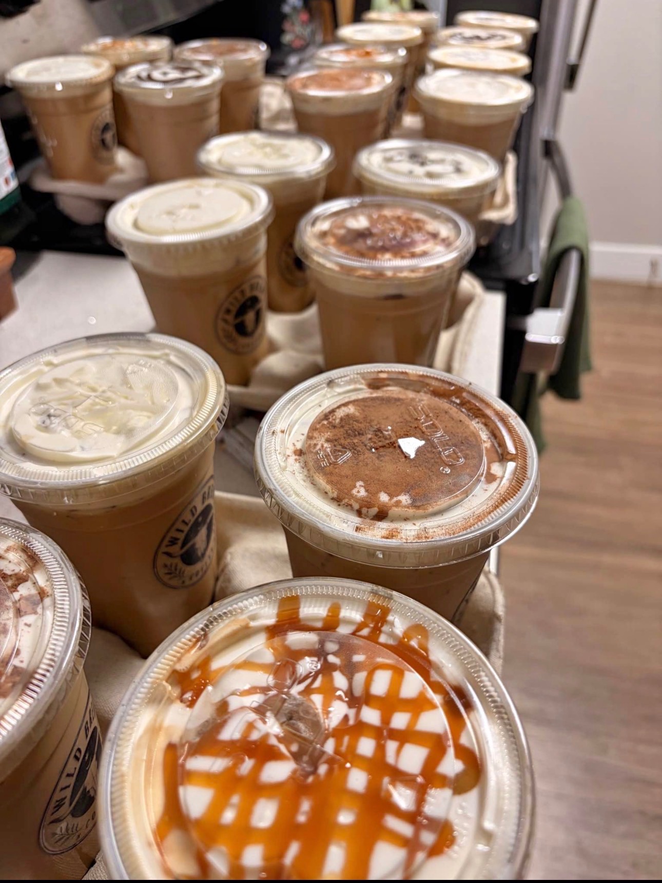 Multiple Wild Brew Coffee trays with iced drinks
