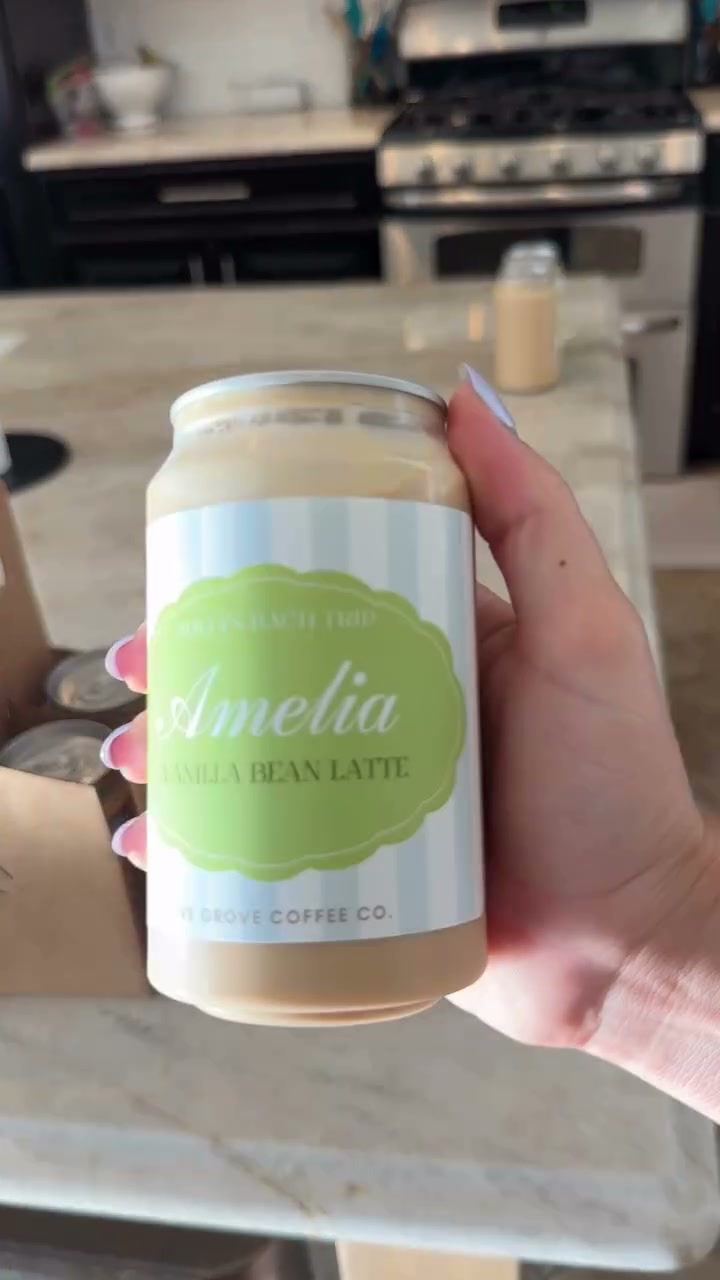 A custom-labeled Olive Grove bottle made for a guest named Amelia, an almond latte
