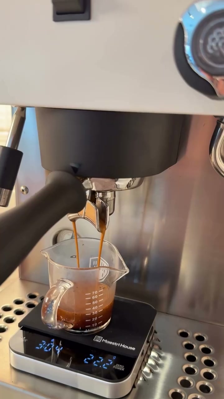 A fresh double shot of espresso pulling from the machine