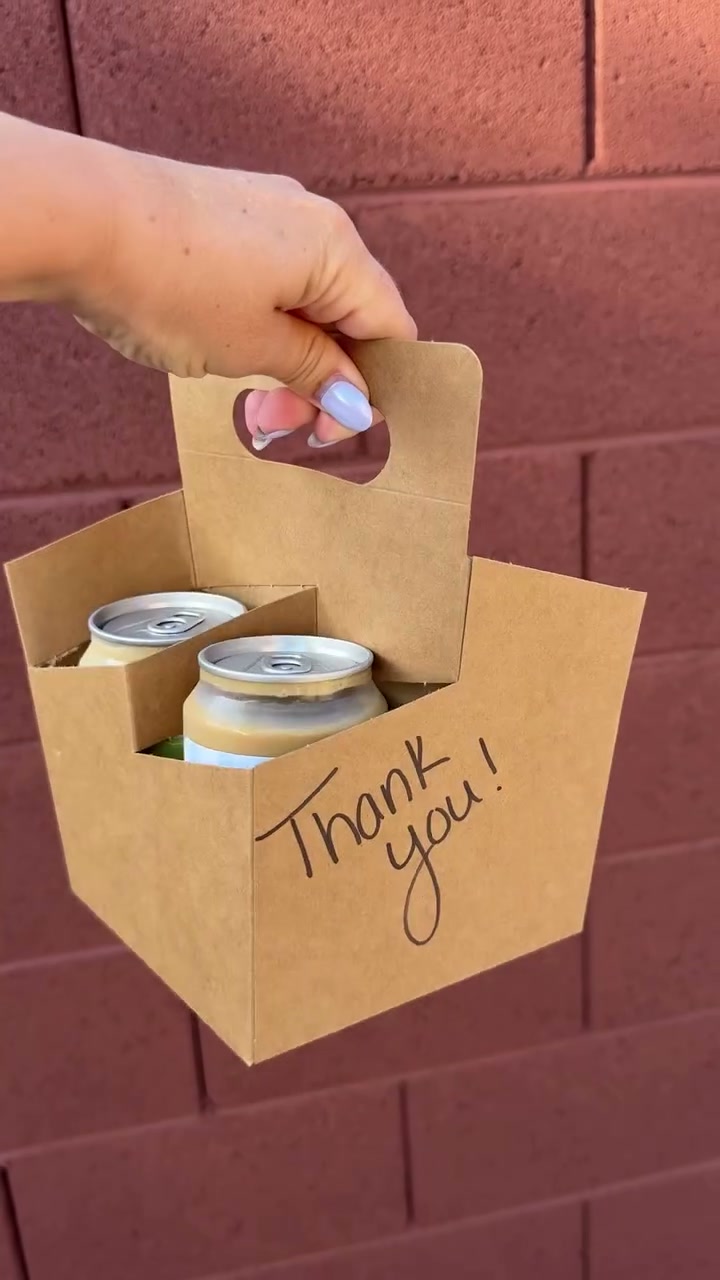 A carrier of bottles with Thank You custom labels